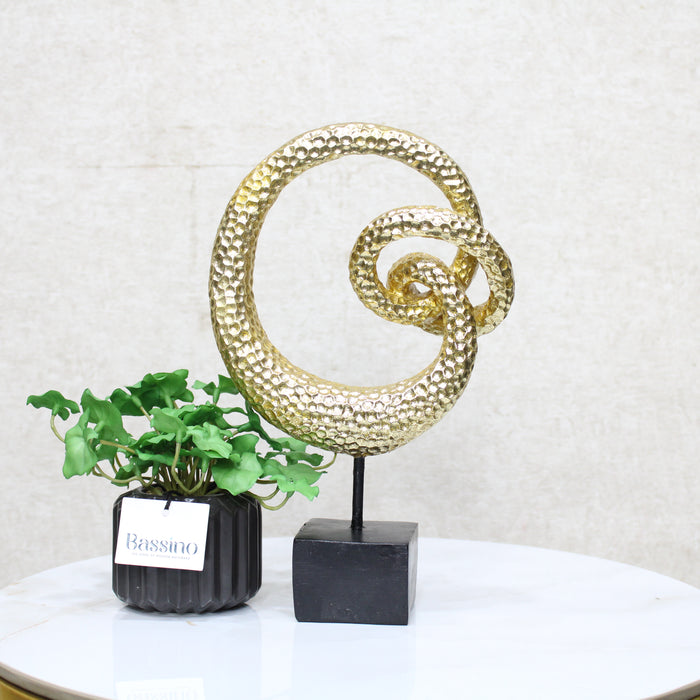 Gold Spiral Loop Sculpture, designed with a hammered-texture finish The abstract spiral form adds movement and dimension, making it an eye-catching accent for console tables, bookshelves, or office desks. BSP-8216 L 18 W 7 H 29