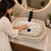 600x380x150 mm beige artificial stone table top wash basin with matte natural stone finish, rounded rectangular countertop basin for modern luxury bathroom.