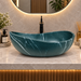 600x380x200 mm deep green artificial stone table top wash basin with matte finish, white marble-style veining and sculpted oval design for modern luxury bathrooms.