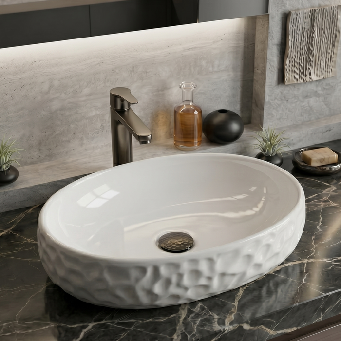 Bassino Textured Oval Countertop Wash Basin (19" x 13" x 5.5") – Modern Ceramic Sink with Sculpted Exterior Design