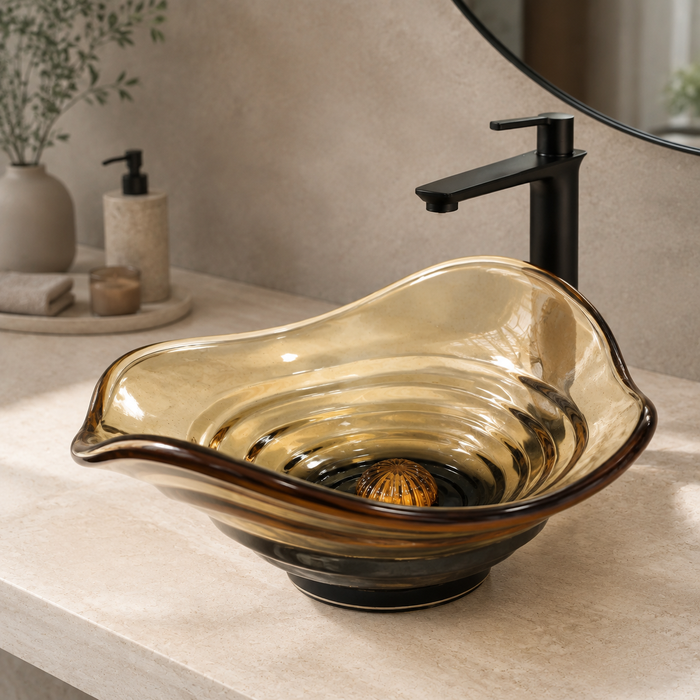 Amber sculptural glass table top wash basin with layered contours, smoky-Orange centre and matching glass waste coupling.
