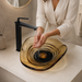 Amber sculptural glass table top wash basin with layered contours, smoky-Orange centre and matching glass waste coupling.