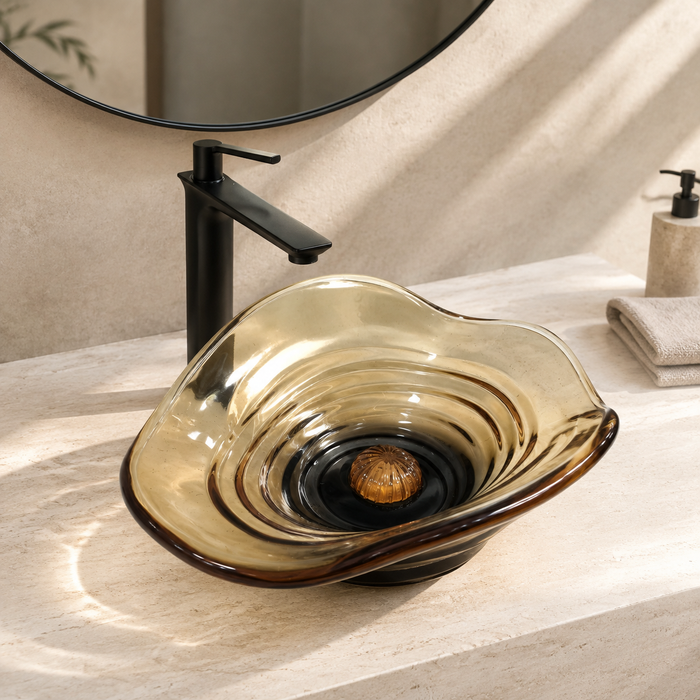 Amber sculptural glass table top wash basin with layered contours, smoky-Orange centre and matching glass waste coupling.