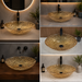 Bassino amber crystal glass table top wash basin 500x360x155 mm with textured faceted oval design for luxury modern bathroom countertop.