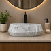 Bassino grey marble designer table top wash basin 560 × 360 × 170 mm with modern rounded rectangular shape for luxury bathroom countertops.