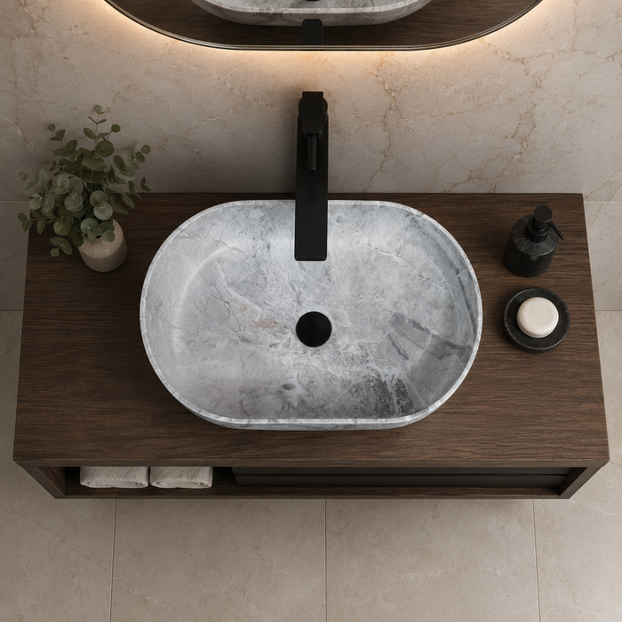 Bassino grey marble designer table top wash basin 560 × 360 × 170 mm with modern rounded rectangular shape for luxury bathroom countertops.