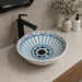 Bassino handmade ceramic table top wash basin 400 × 400 × 120 mm with blue and white decorative pattern, round design and glossy finish for modern luxury bathrooms.