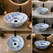 Bassino handmade ceramic table top wash basin 400 × 400 × 120 mm with blue floral pattern, white glossy finish and round countertop design for modern bathrooms.
