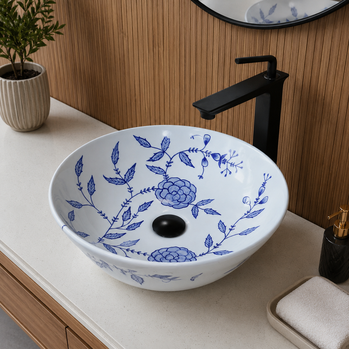 Bassino handmade ceramic table top wash basin 400 × 400 × 120 mm with blue floral pattern, white glossy finish and round countertop design for modern bathrooms.