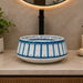 Bassino handmade ceramic table top wash basin 400 × 400 × 150 mm with blue and white decorative design and glossy finish for luxury bathrooms.