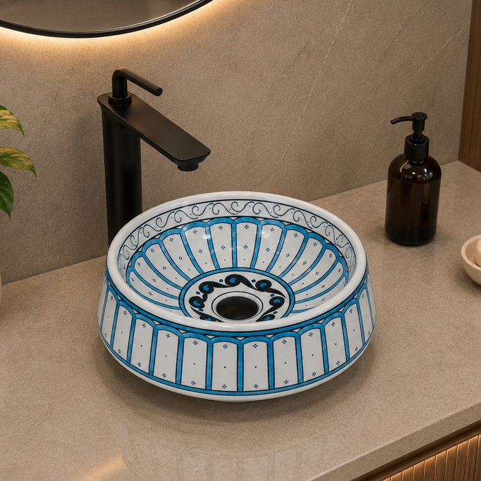 Bassino handmade ceramic table top wash basin 400 × 400 × 150 mm with blue and white decorative design and glossy finish for luxury bathrooms.