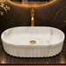 Bassino premium oval ceramic table top wash basin with matte ivory marble design
