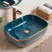 Bassino teal blue and gold ceramic table top wash basin 18x13x5 inch glossy designer countertop basin for modern luxury bathroom.