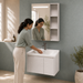 Bassino white wall-mounted bathroom vanity set with LED mirror cabinet, open side shelves and ceramic basin.