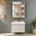 Bassino white wall-mounted bathroom vanity set with LED mirror cabinet, open side shelves and ceramic basin.