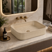 Beige designer table top wash basin with decorative pattern, rounded rectangular shape and 500 × 345 × 120 mm size for modern bathroom countertop.