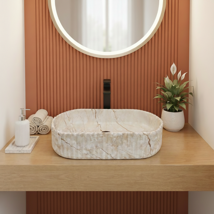 Beige marble fluted ceramic table top wash basin, 510x310x120 mm, with oval oblong shape and ribbed exterior for modern luxury bathrooms.
