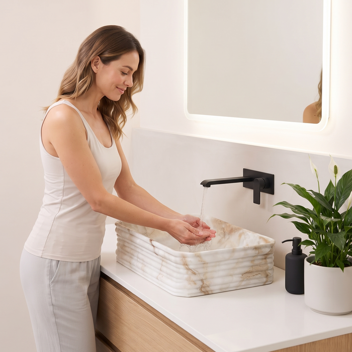 Beige onyx marble pattern ceramic rectangular table top wash basin 460x325x125 mm with rounded corners and horizontal ribbed exterior.