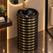 Black and gold luxury floor standing pedestal wash basin with glossy cylindrical design, horizontal gold detailing and 440 × 440 × 820 mm size for modern bathrooms.