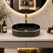 Black and gold luxury table top wash basin with glossy interior, vertical gold detailing and 490 × 320 × 150 mm size for modern bathroom countertops.