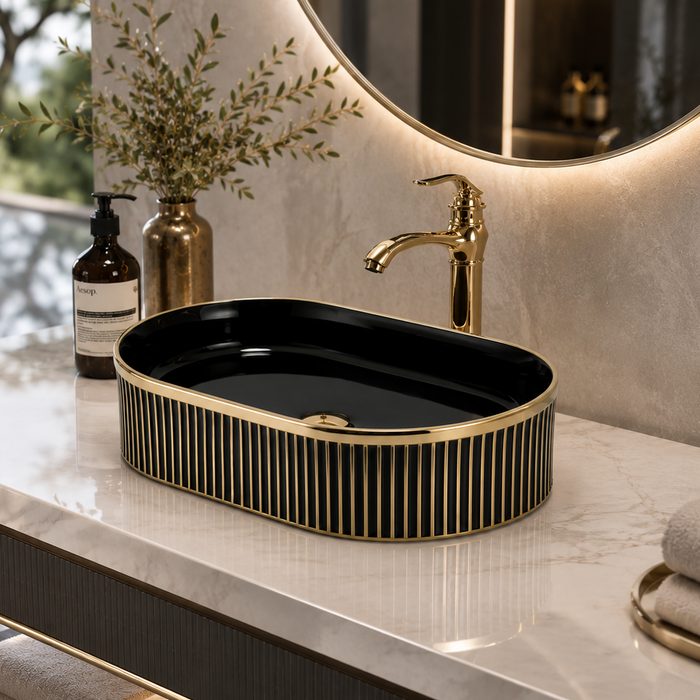 Black and gold luxury table top wash basin with glossy interior, vertical gold detailing and 490 × 320 × 150 mm size for modern bathroom countertops.