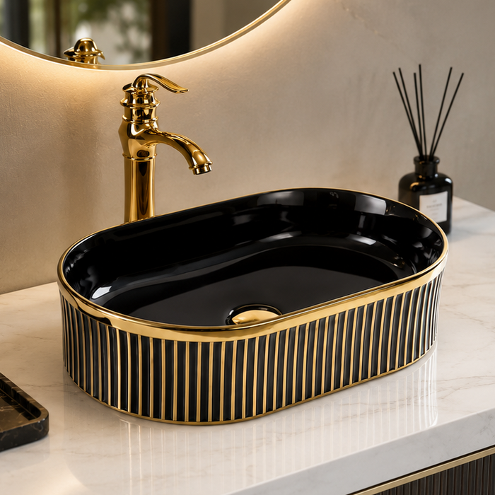 Black and gold luxury table top wash basin with glossy interior, vertical gold detailing and 490 × 320 × 150 mm size for modern bathroom countertops.