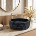 Black artificial stone table top wash basin with matte finish, round shape and raw rock-textured exterior, 400 × 400 × 140 mm.