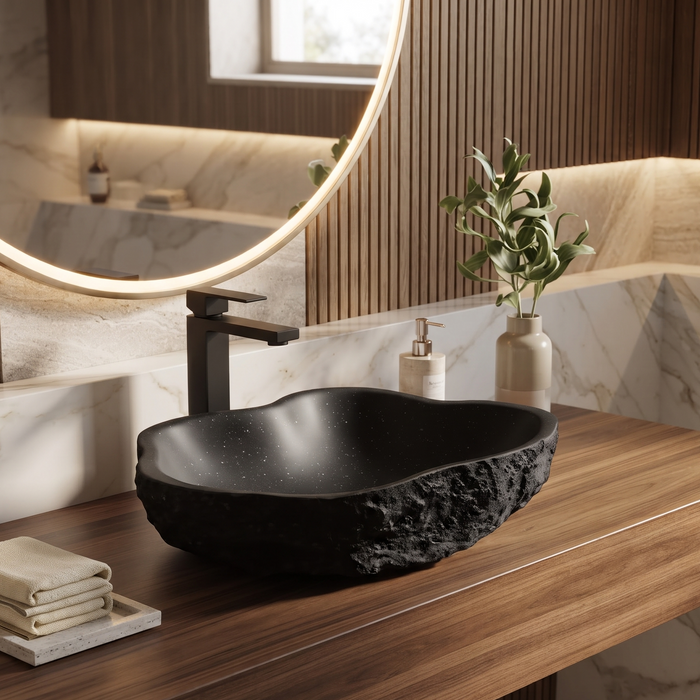 Black artificial stone table top wash basin with organic free-form shape, rough rock-textured exterior and 490 × 370 × 140 mm size.