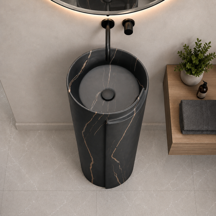 Black ceramic pedestal wash basin with rose-gold marble-effect veining, modern cylindrical freestanding design and 400 × 400 × 850 mm size for luxury bathrooms.