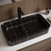 Black marble-look ceramic table top wash basin with gold and grey veins, glossy rectangular countertop basin measuring 750 × 400 × 140 mm for modern bathrooms.