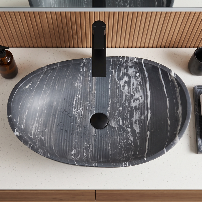 Black marble finish artificial stone table top wash basin with white veining, 600×380×200 mm, matte oval countertop sink for modern luxury bathrooms.