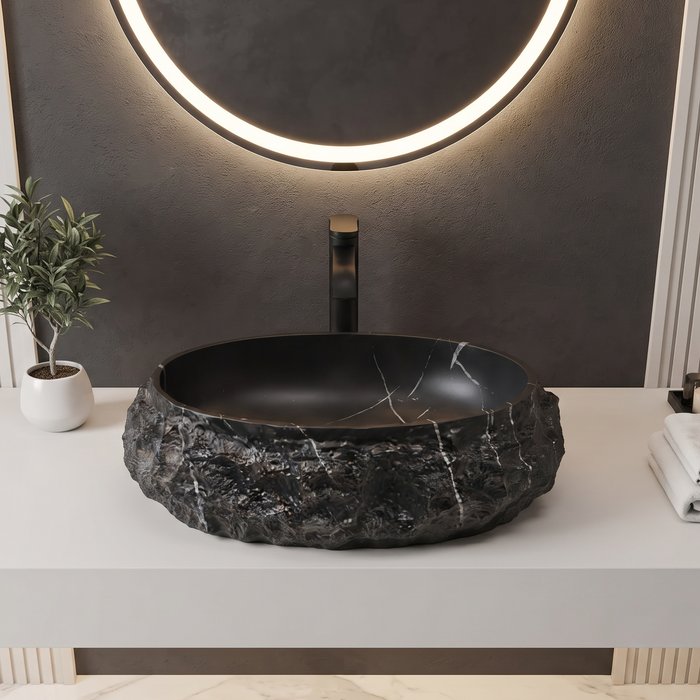 Black stone texture oval ceramic table top wash basin 500x375x150 mm with white marble veining and rough rock exterior for luxury bathrooms.