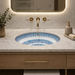 Blue and white designer ceramic under counter wash basin with glossy finish, 405 × 405 × 180 mm round undermount bathroom basin with decorative pattern.