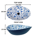 Blue and white floral ceramic table top wash basin with glossy finish, oval designer countertop basin measuring 555 × 355 × 170 mm for modern bathrooms.