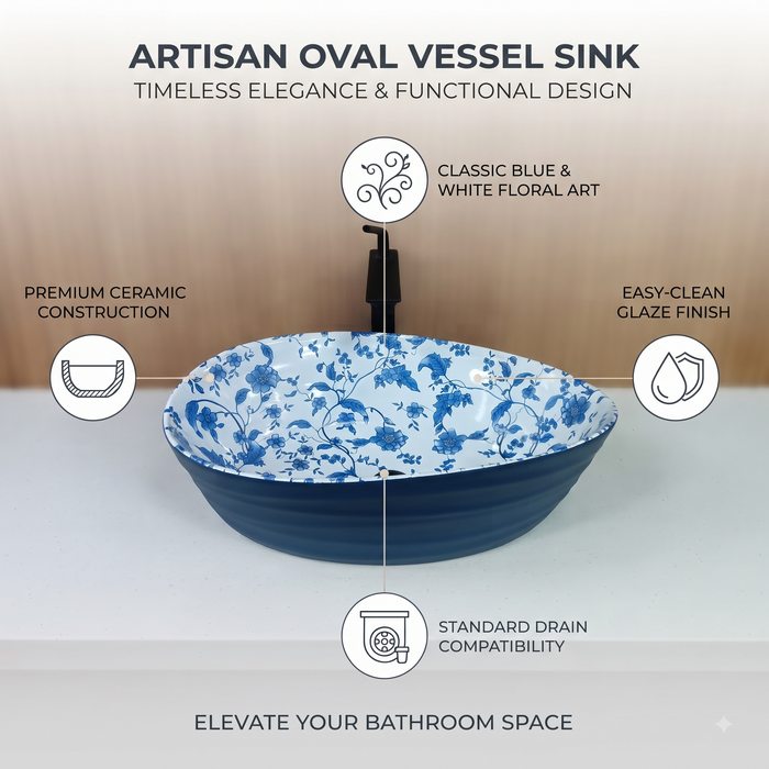 Blue and white floral ceramic table top wash basin with glossy finish, oval designer countertop basin measuring 555 × 355 × 170 mm for modern bathrooms.
