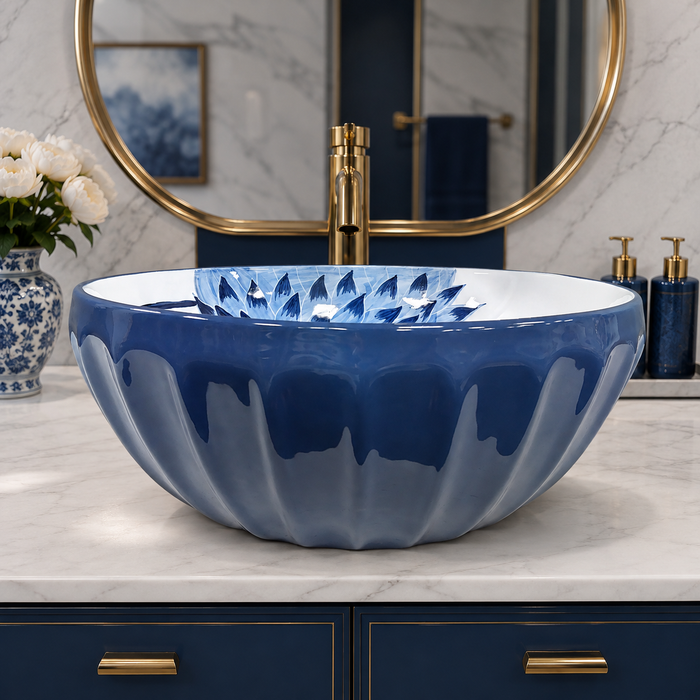 Blue and white floral round ceramic table top wash basin 375x375x125 mm with matte finish and sculpted fluted exterior design.