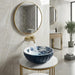 Blue and white floral round ceramic table top wash basin 375x375x125 mm with matte finish and sculpted fluted exterior design.