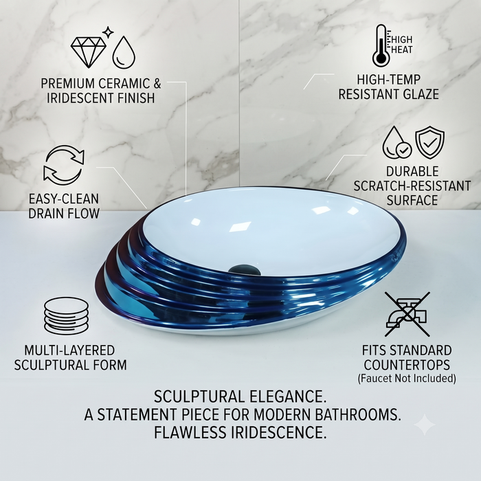 Blue and white glossy ceramic table top wash basin with oval layered design, 520 × 380 × 150 mm designer countertop basin for modern luxury bathrooms.