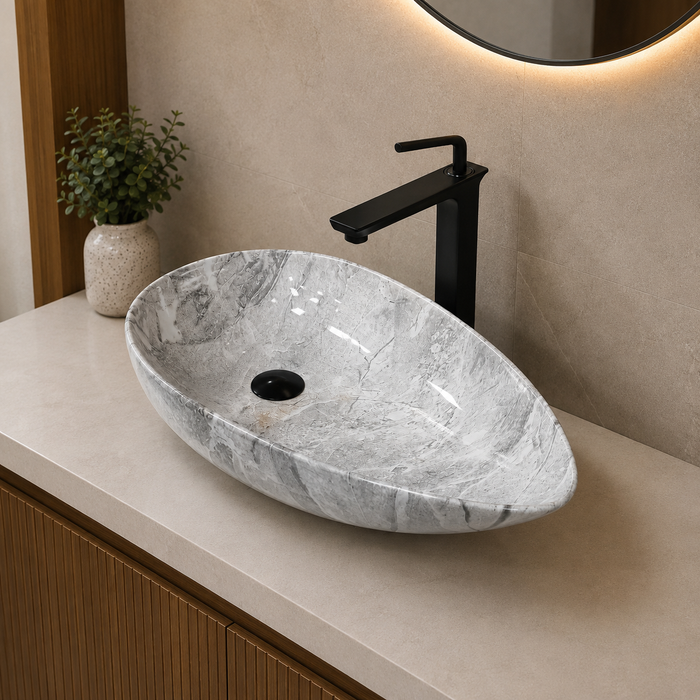Designer grey and white marble pattern table top wash basin 560 × 355 × 130 mm with glossy finish and asymmetrical oval shape for modern luxury bathrooms.