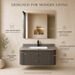 Floating grey bathroom vanity with two drawers, gold knobs and white basin