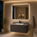 Floating grey bathroom vanity with two drawers, gold knobs and white basin
