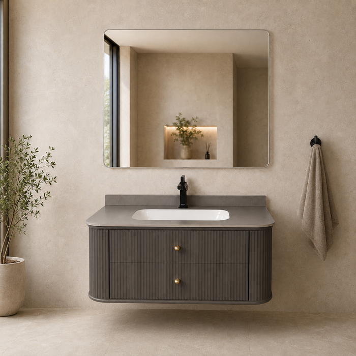 Floating grey bathroom vanity with two drawers, gold knobs and white basin