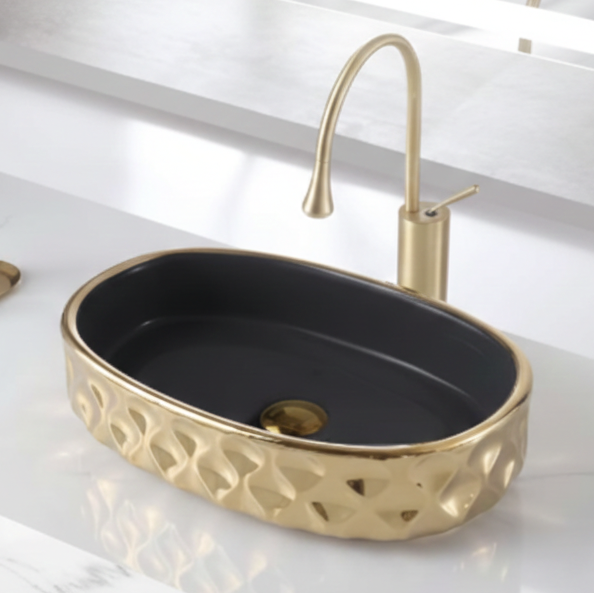 Bathroom sink with gold faucet and decorative basin in a modern bathroom setting.