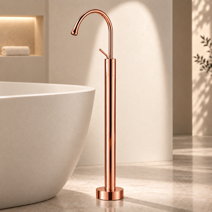 Glossy Rose gold floor mount basin faucet with tall curved spout and single lever handle, modern freestanding bathroom tap for luxury wash basin installations by Bassino.