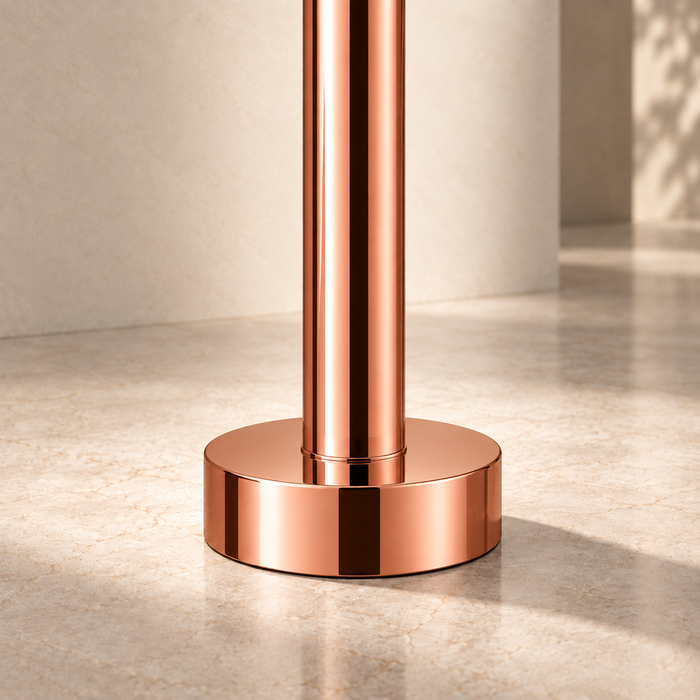Glossy Rose gold floor mount basin faucet with tall curved spout and single lever handle, modern freestanding bathroom tap for luxury wash basin installations by Bassino.