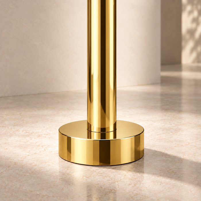 Glossy gold floor mount basin faucet with tall curved spout and single lever handle, modern freestanding bathroom tap for luxury wash basin installations by Bassino.