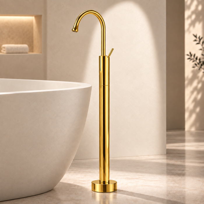 Glossy gold floor mount basin faucet with tall curved spout and single lever handle, modern freestanding bathroom tap for luxury wash basin installations by Bassino.