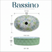 Green blue and white floral ceramic table top wash basin with glossy finish, oval designer countertop basin measuring 500 × 320 × 140 mm for modern bathrooms.