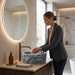Grey artificial stone table top wash basin with matte finish, round shape and natural rock textured exterior, 400 × 400 × 140 mm.