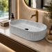 Grey marble fluted ceramic table top wash basin, 510x310x120 mm, with ribbed rounded rectangular design for modern bathrooms.